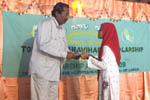 Scholar receiving Certificate